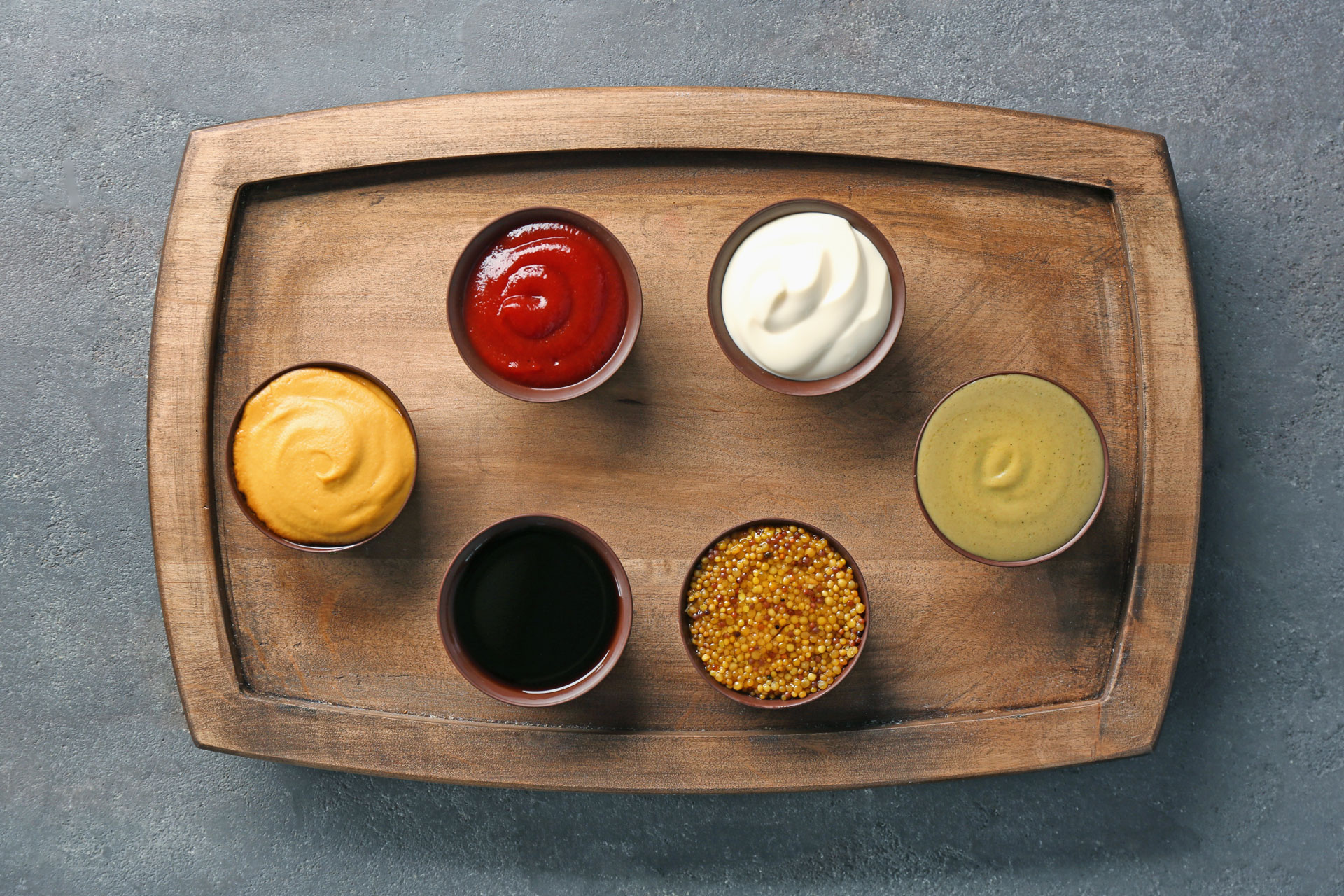 small cups of condiments