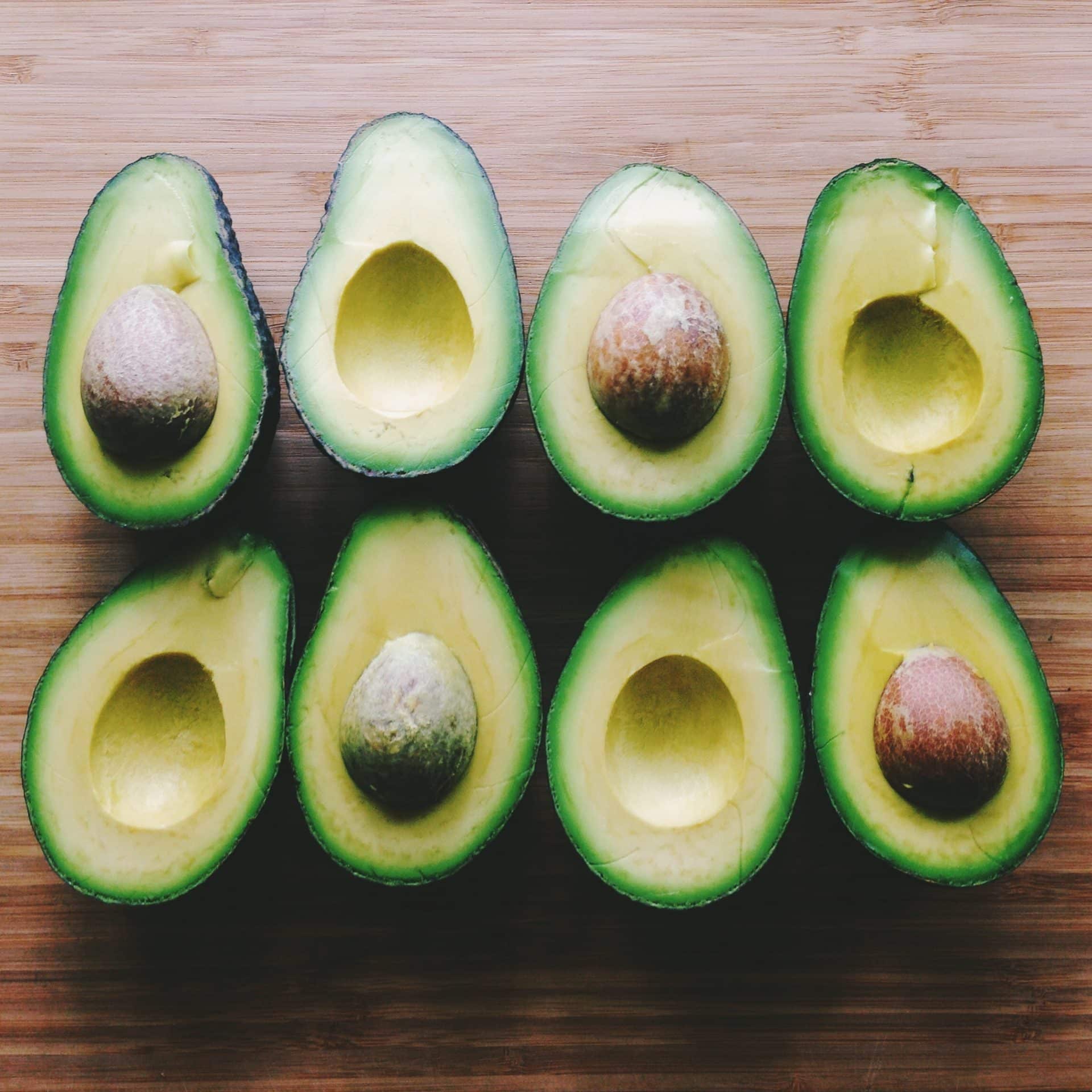 Fresh avocados and pits