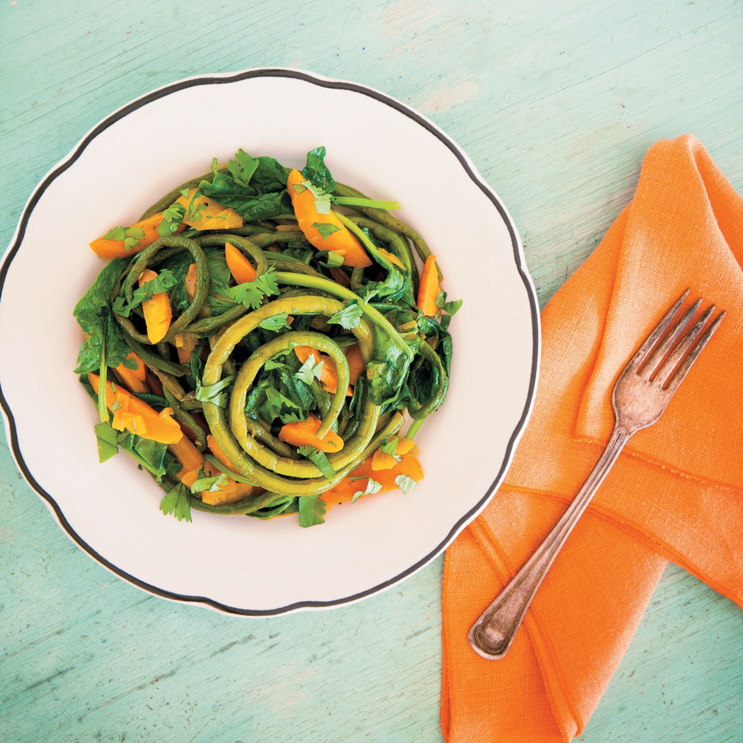 Yardlong bean curry with wilted spinach from “The CSA Cookbook” by Linda Ly. Photograph by Will Taylor.