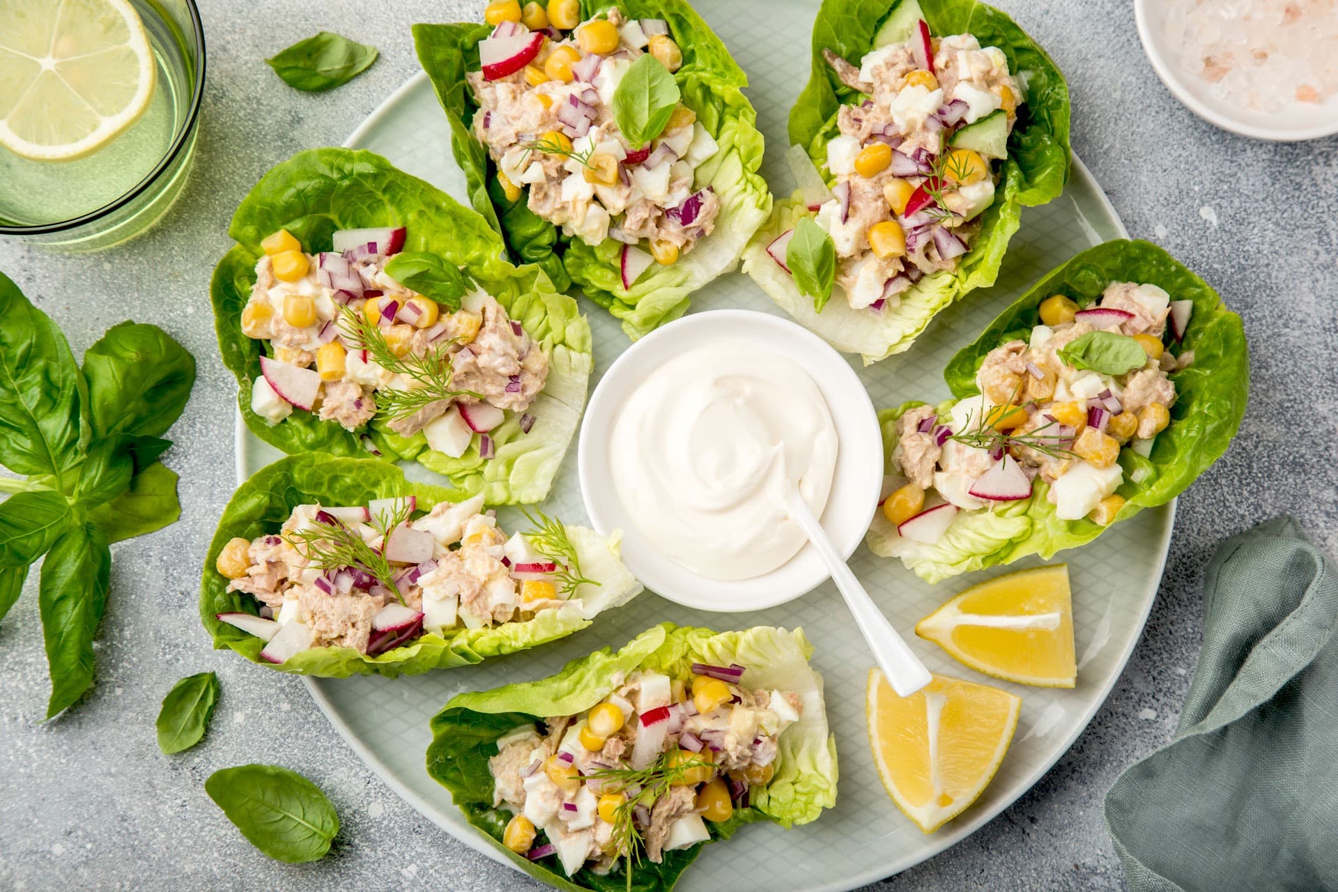 Tuna salad lettuce wraps on white plate