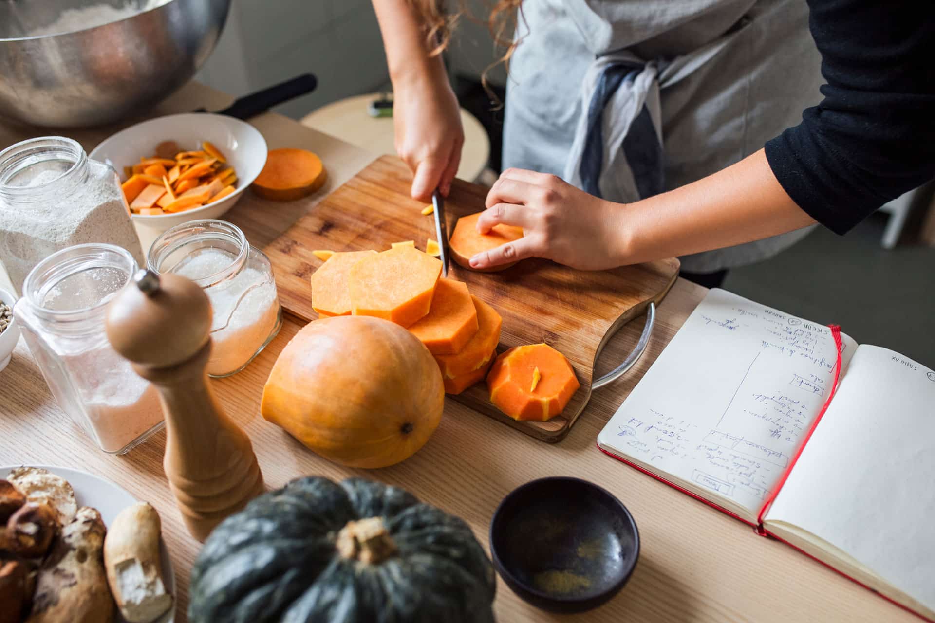 Cutting up butternut squash in the kitchen