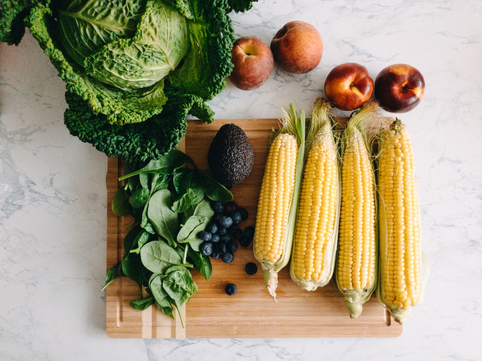 Fresh summer produce on cutting board