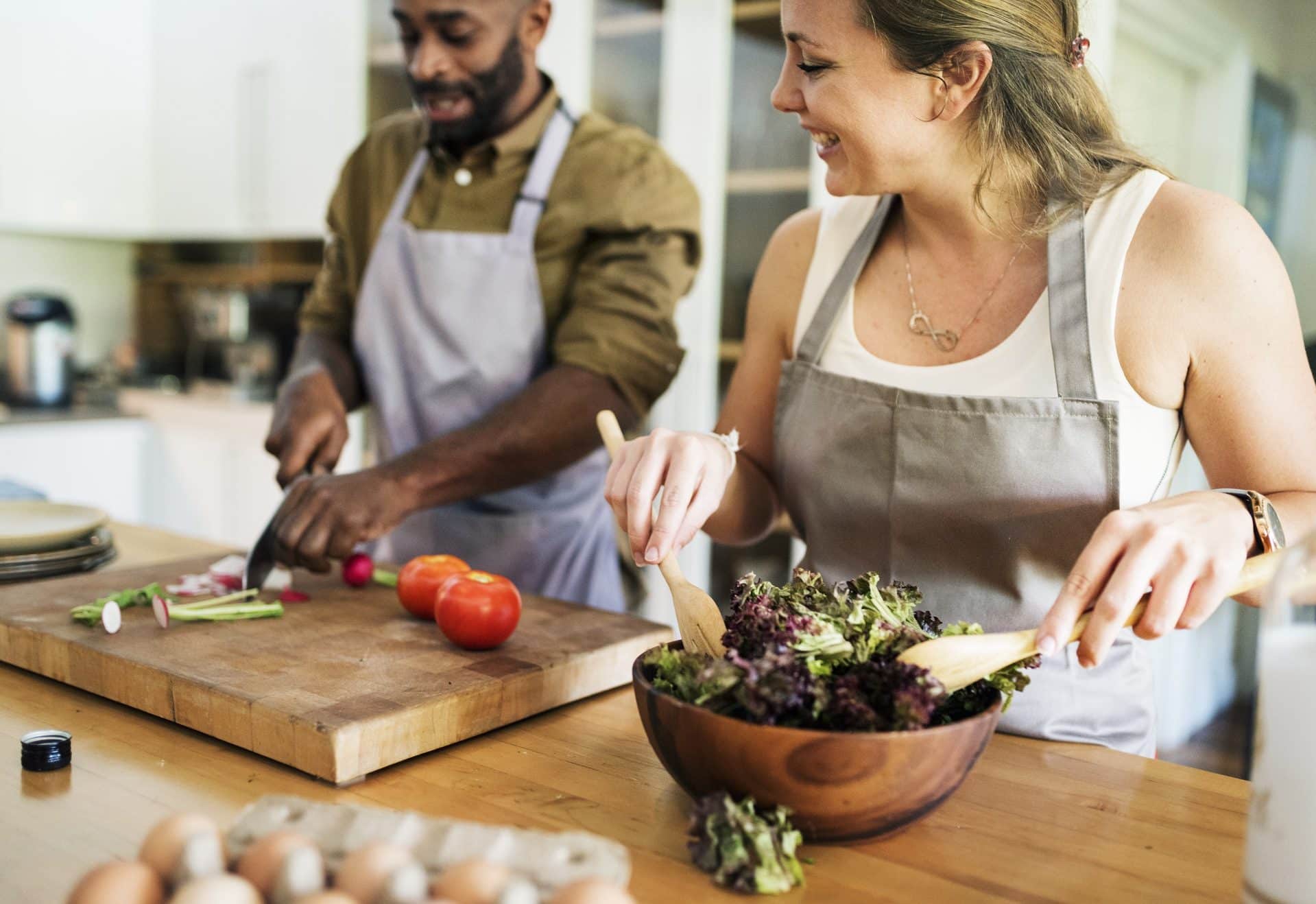 Two people cooking sustainably.