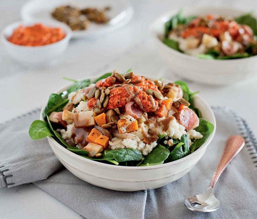 bowl of roasted sweet potatoes, spinach, sunflower seeds