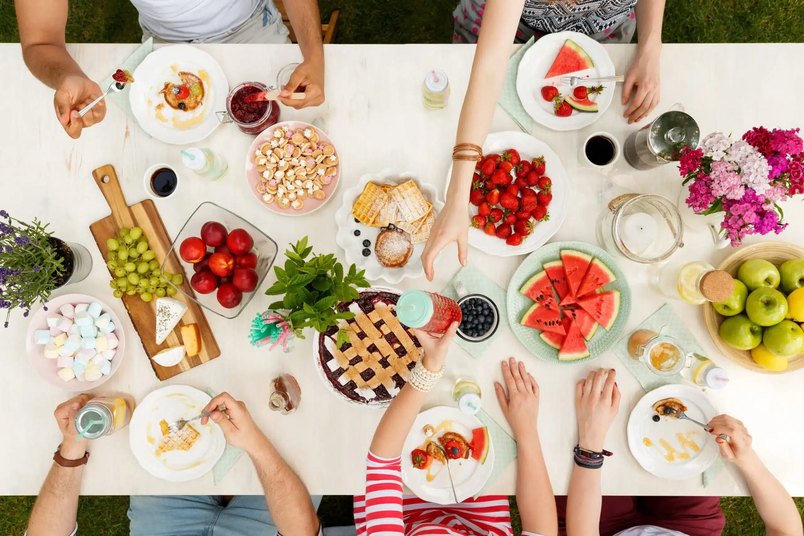 people sharing food around a table